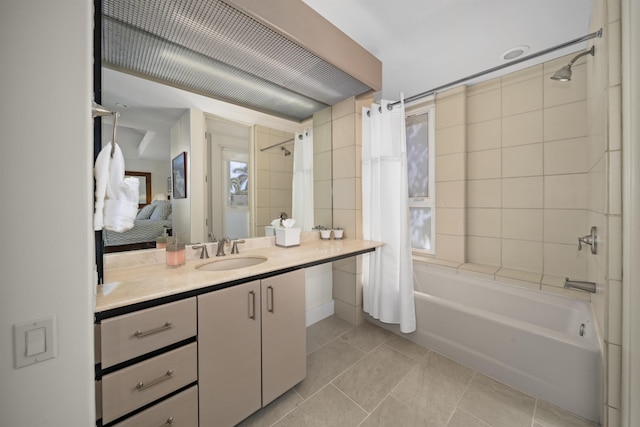 bathroom featuring vanity, tile patterned flooring, and shower / bath combo with shower curtain