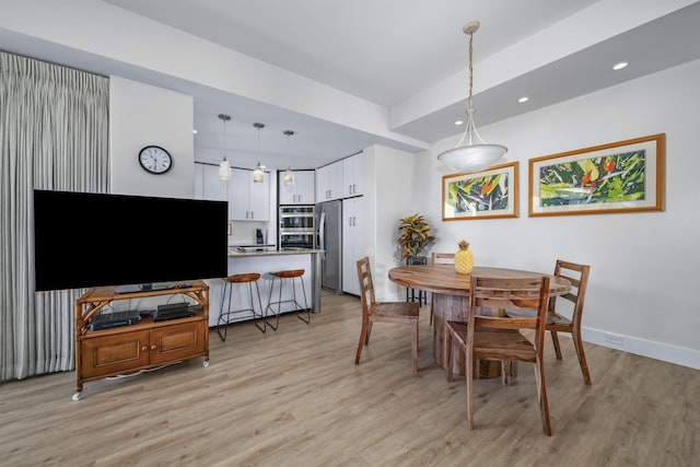 dining room with light hardwood / wood-style floors