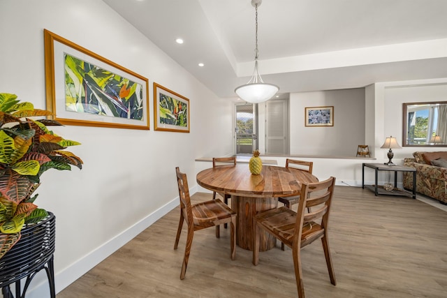 dining area with light hardwood / wood-style flooring