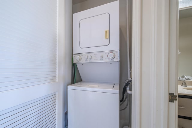 laundry room featuring stacked washer and dryer