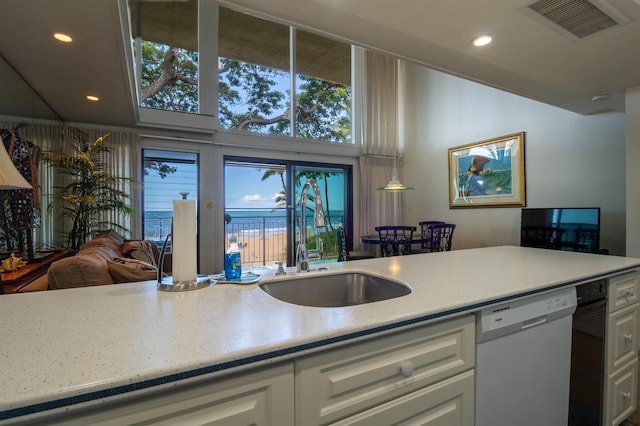 2230 S Kihei Rd Unit 9, Kihei, HI 96753 - kitchen with dishwasher, white cabinets, recessed lighting, light stone counters, and high vaulted ceiling