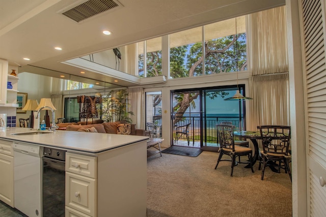 2230 S Kihei Rd Unit 9, Kihei, HI 96753 - kitchen with carpet, dishwasher, white cabinetry, light countertops, and plenty of natural light