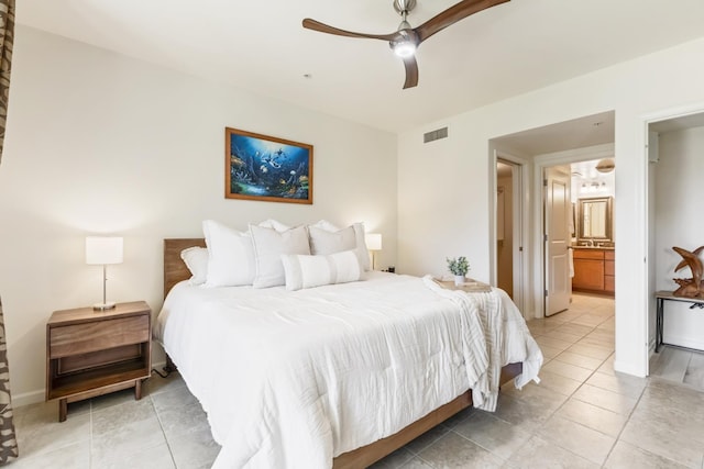 bedroom featuring light tile patterned floors, a ceiling fan, visible vents, and ensuite bath