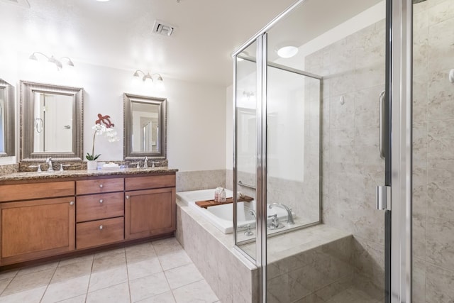 bathroom with tile patterned floors, a stall shower, double vanity, visible vents, and a garden tub