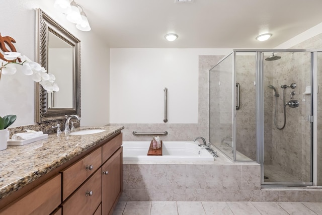 full bathroom with a bath, tile patterned flooring, a shower stall, and vanity