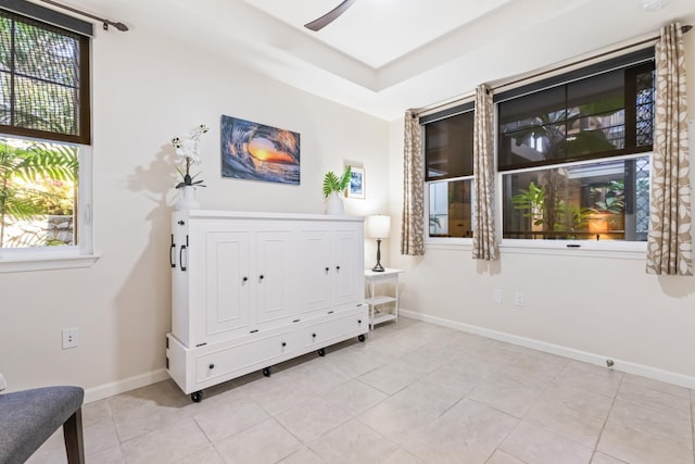 sitting room with light tile patterned flooring and baseboards