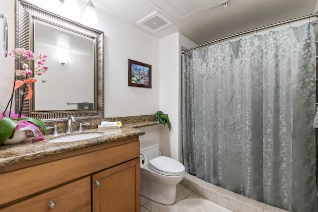 bathroom featuring vanity, curtained shower, toilet, visible vents, and tile patterned flooring