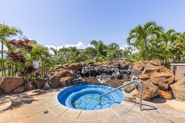 view of pool featuring a hot tub