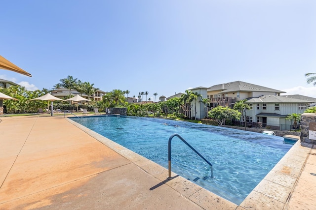 outdoor pool featuring a residential view