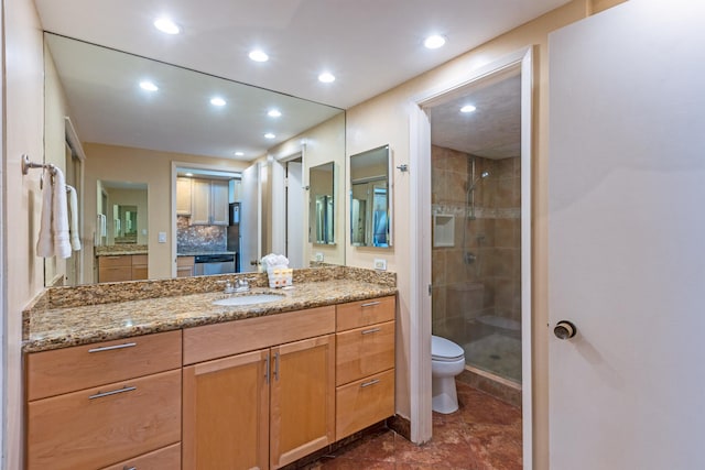 full bathroom with toilet, a stall shower, recessed lighting, and vanity