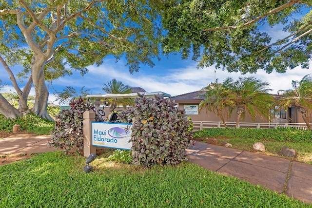 community sign with fence