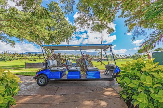 view of vehicle parking with a mountain view