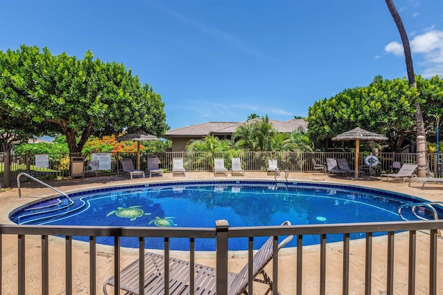 community pool featuring fence