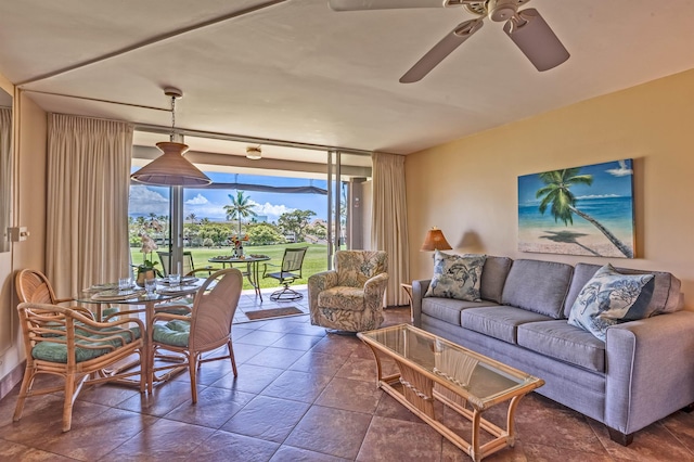 living area with a ceiling fan