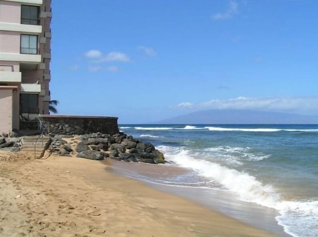 property view of water featuring a beach view