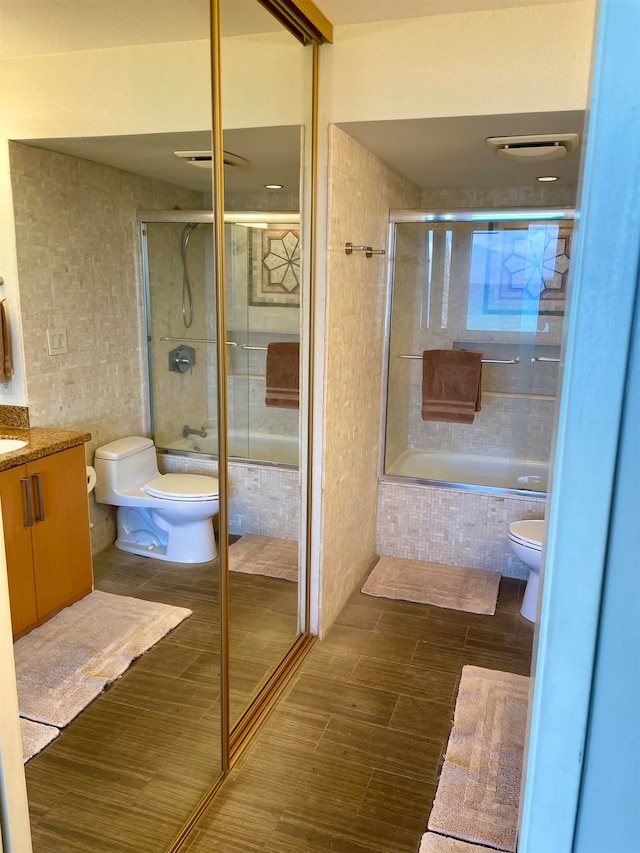 bathroom featuring toilet, vanity, and tile patterned floors