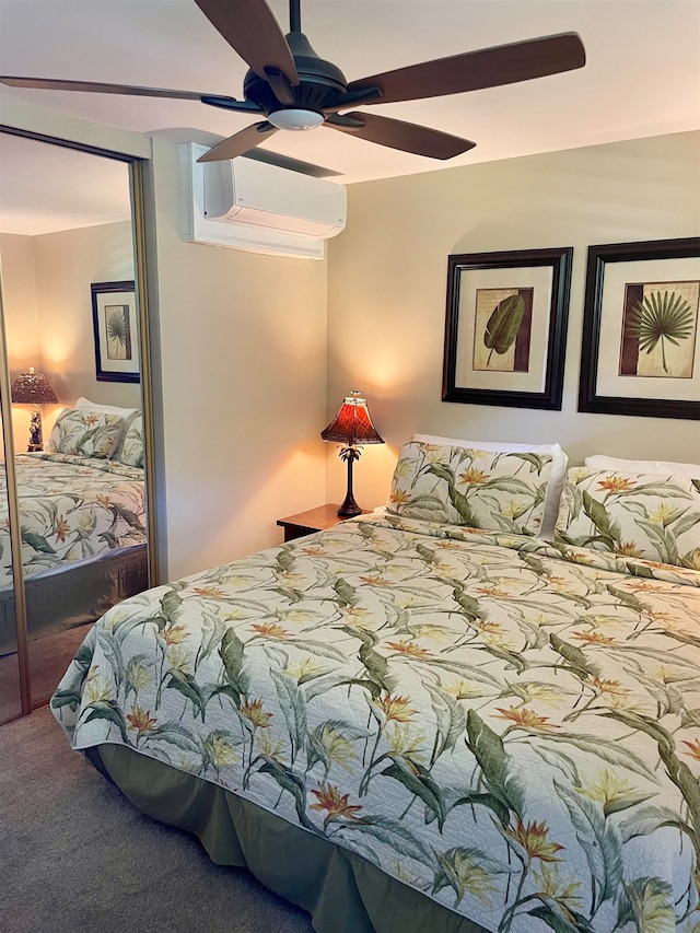 carpeted bedroom featuring a closet, ceiling fan, and a wall mounted AC