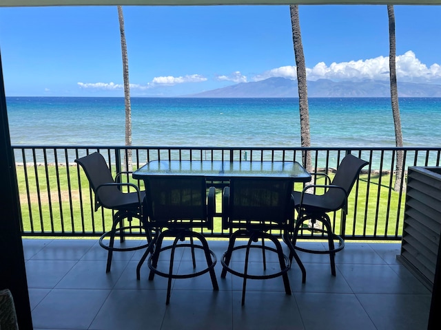 balcony with a water and mountain view