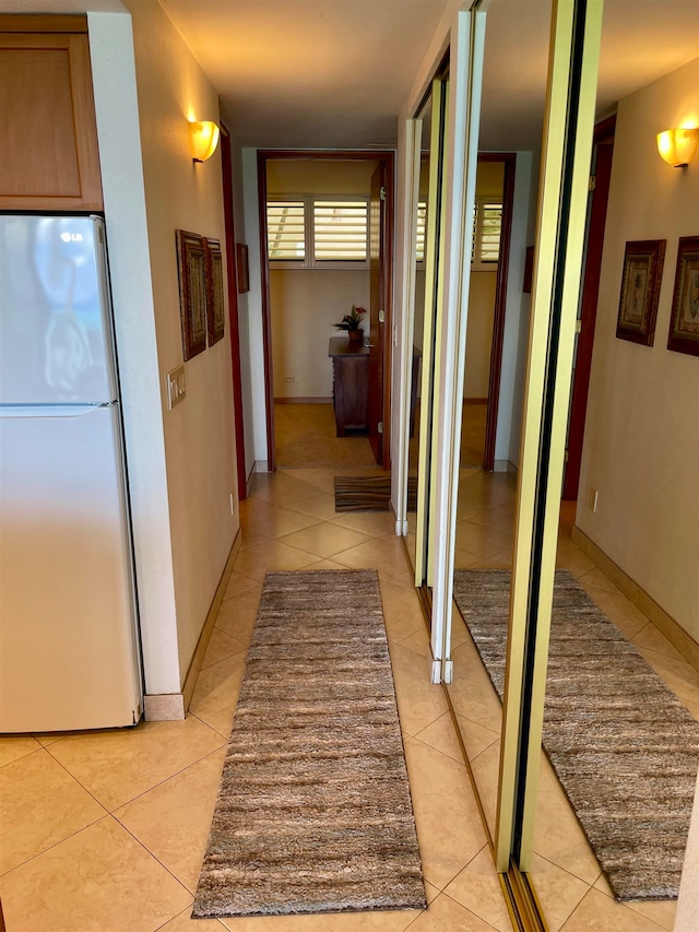 corridor with light tile patterned floors