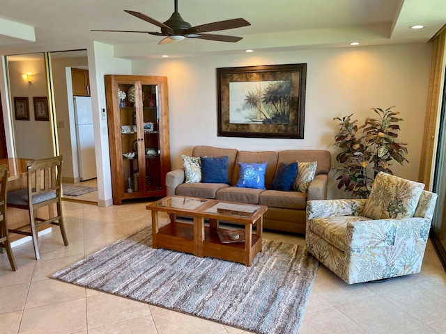 tiled living room featuring ceiling fan