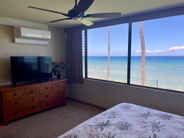 carpeted bedroom featuring ceiling fan, a wall mounted AC, and a water view