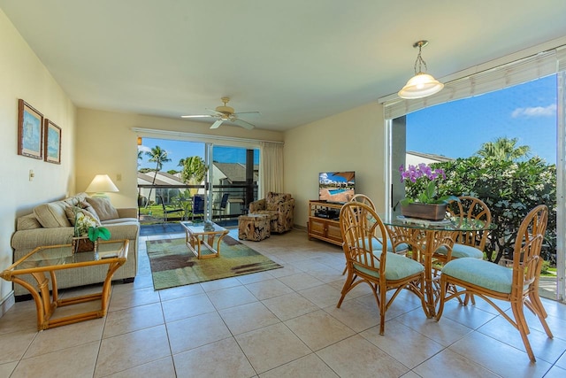 tiled living room with ceiling fan and a wealth of natural light