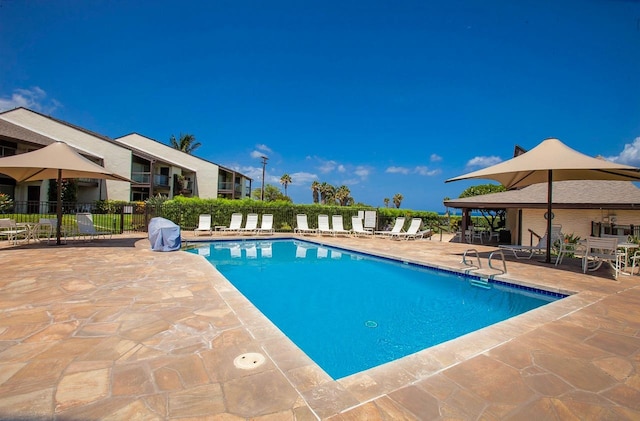 view of swimming pool featuring a patio area