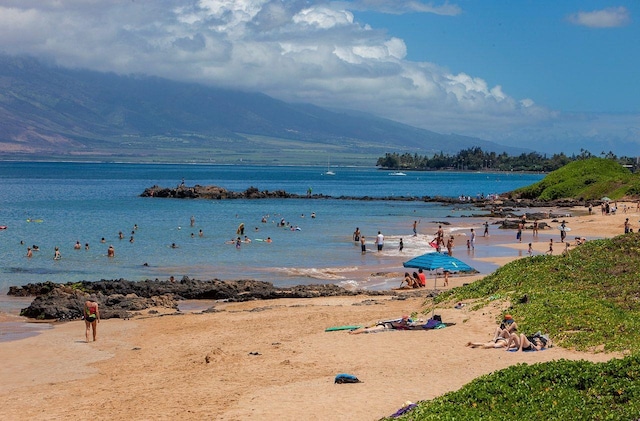 property view of water with a mountain view and a beach view