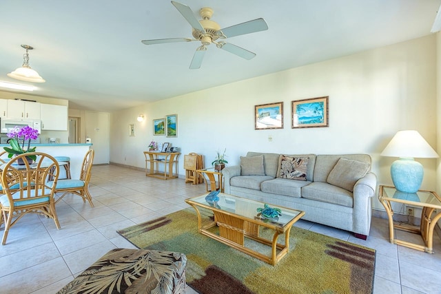 living room with ceiling fan and light tile patterned floors