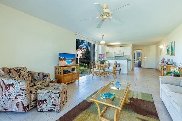 tiled living room with ceiling fan