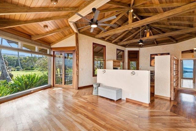 interior space with lofted ceiling with beams, ceiling fan, and wood ceiling