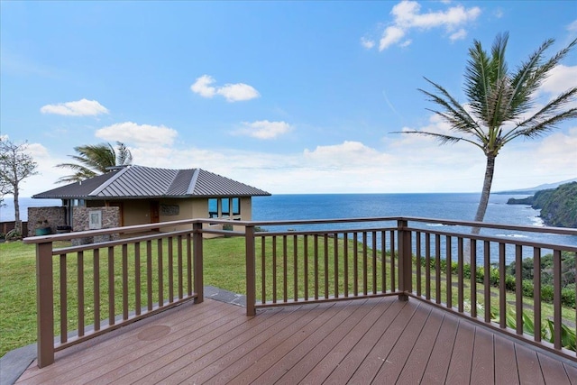 deck with a lawn and a water view