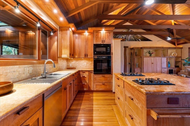 kitchen with sink, vaulted ceiling with beams, wood ceiling, decorative backsplash, and black appliances