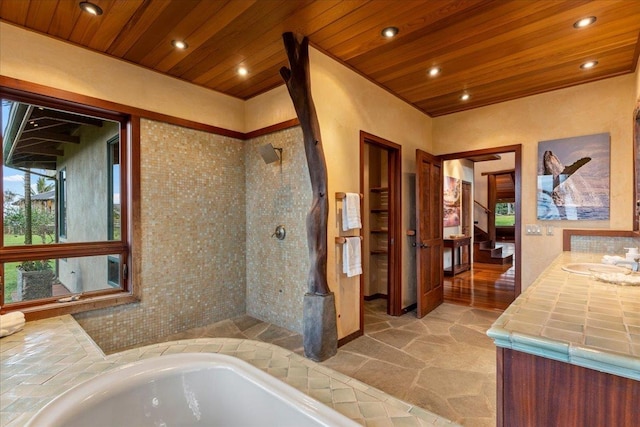 bathroom with wood ceiling, vanity, and independent shower and bath