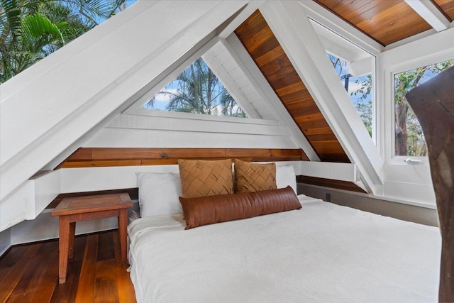 bedroom featuring vaulted ceiling with beams, wooden ceiling, and dark hardwood / wood-style flooring