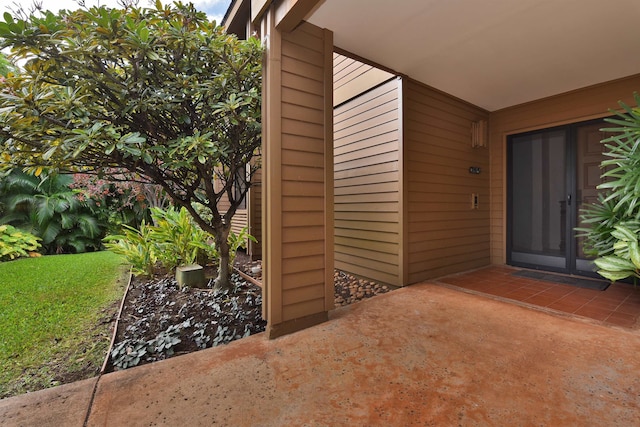 entrance to property featuring a patio area