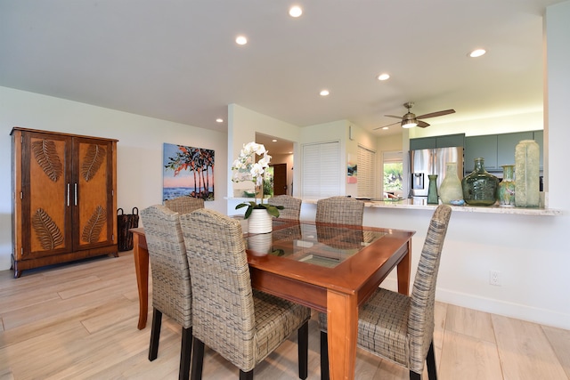 dining area featuring ceiling fan and light hardwood / wood-style floors