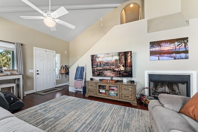 living room featuring ceiling fan, beamed ceiling, high vaulted ceiling, and dark hardwood / wood-style flooring