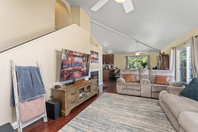 living room featuring dark hardwood / wood-style flooring, high vaulted ceiling, and ceiling fan