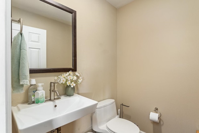 bathroom with toilet and sink