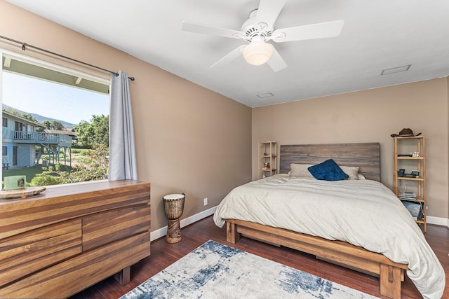 bedroom featuring dark wood-type flooring and ceiling fan