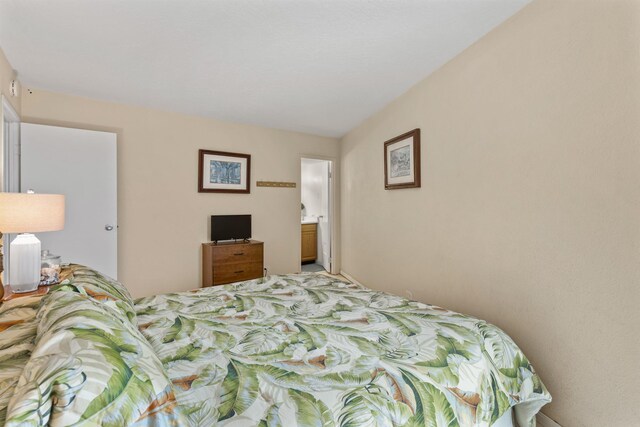 bedroom featuring ensuite bath