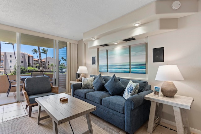 tiled living room with a textured ceiling