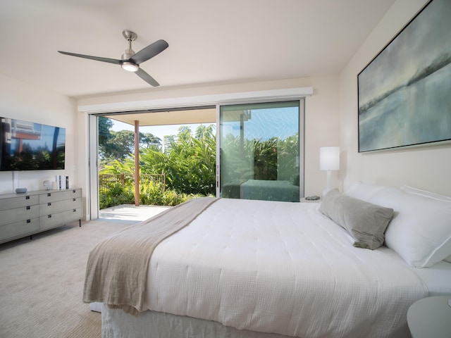 bedroom featuring multiple windows, ceiling fan, and light colored carpet