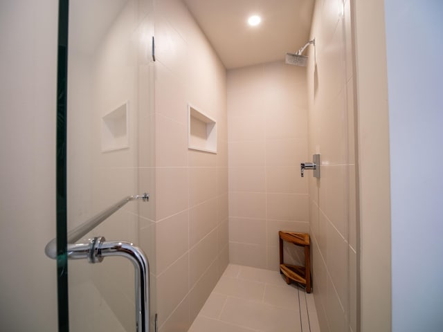 bathroom featuring a shower with shower door