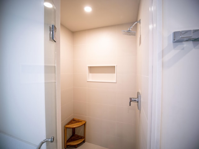 bathroom with tiled shower