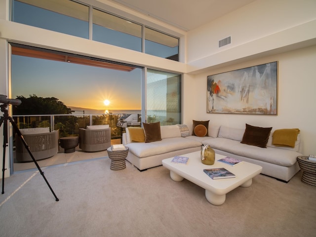 living room with a towering ceiling