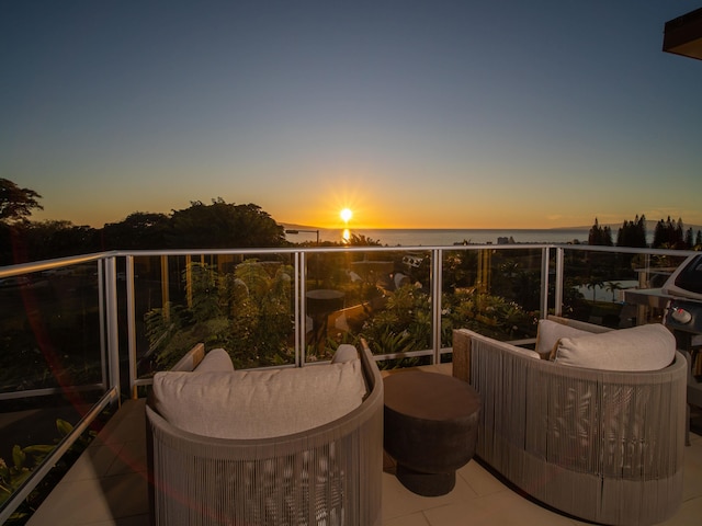 view of balcony at dusk