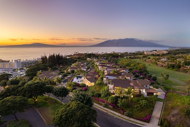 aerial view at dusk with a water and mountain view