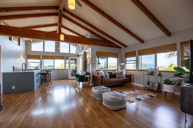 living room featuring beam ceiling, high vaulted ceiling, wood-type flooring, and ceiling fan